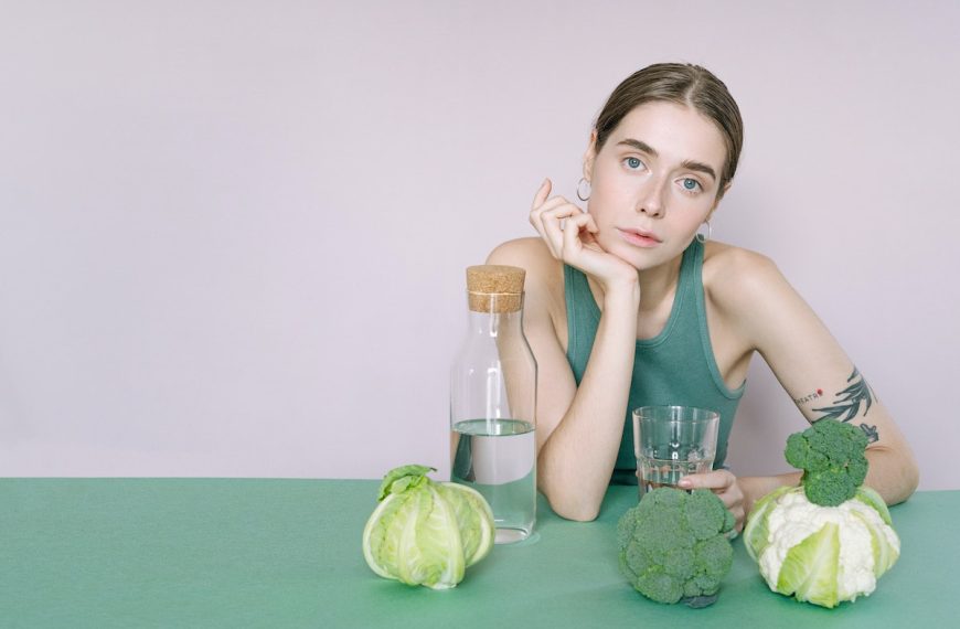 woman with vegetables in front of her
